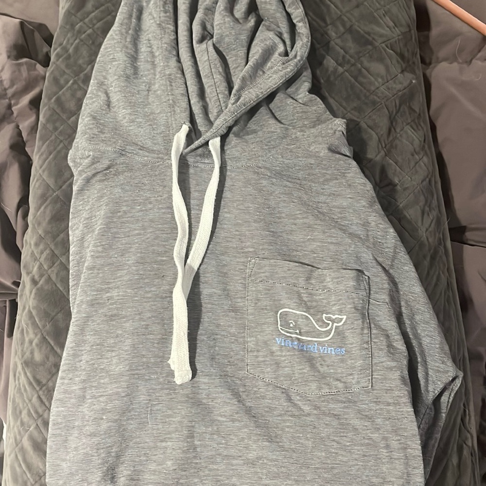 Vineyard vines shirt with hood, lightweight pocket and logo down the arm.